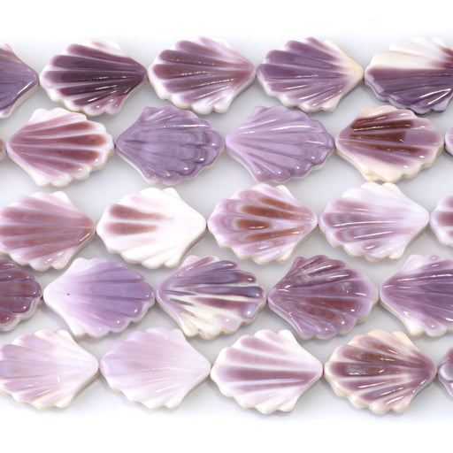 This is a Dakota Stones 12x15mm Wampum Shell Carved Shell Gemstone strand of round beads in 15-16 inch strand.