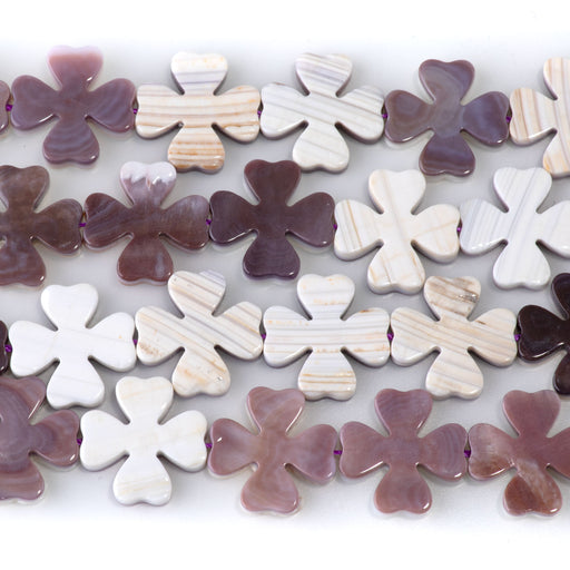 This is a Dakota Stones 15mm Wampum Shell Clover Gemstone strand of round beads in 15-16 inch strand.