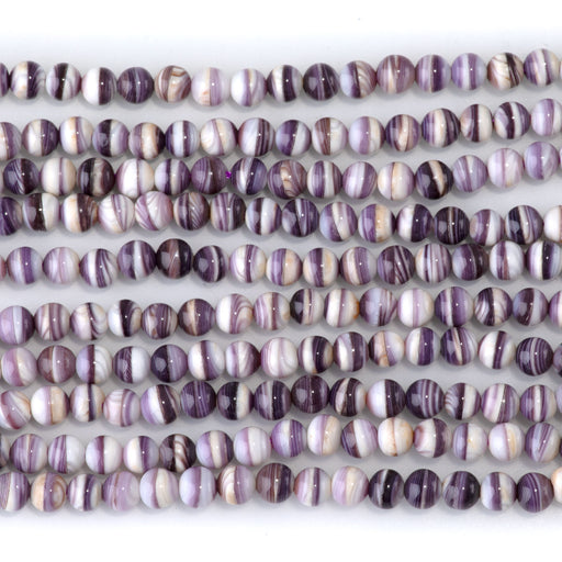 This is a Dakota Stones 4mm Wampum Shell Gemstone strand with round beads in 15-16 inch strand.