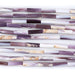 This is a Dakota Stones 4x14mm Wampum Shell Tube Gemstone strand of round beads in 15-16 inch strand.