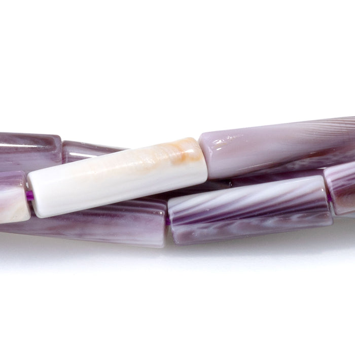 This is a Dakota Stones 4x14mm Wampum Shell Tube Gemstone strand of round beads in 15-16 inch strand.