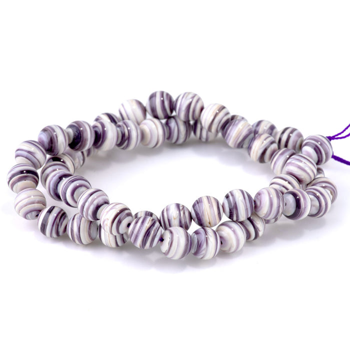 This is a Dakota Stones 8mm Purple Shell Gemstone strand with round beads in 15-16 inch strand.