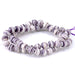 This is a Dakota Stones 8mm Purple Shell Gemstone strand with round beads in 15-16 inch strand.
