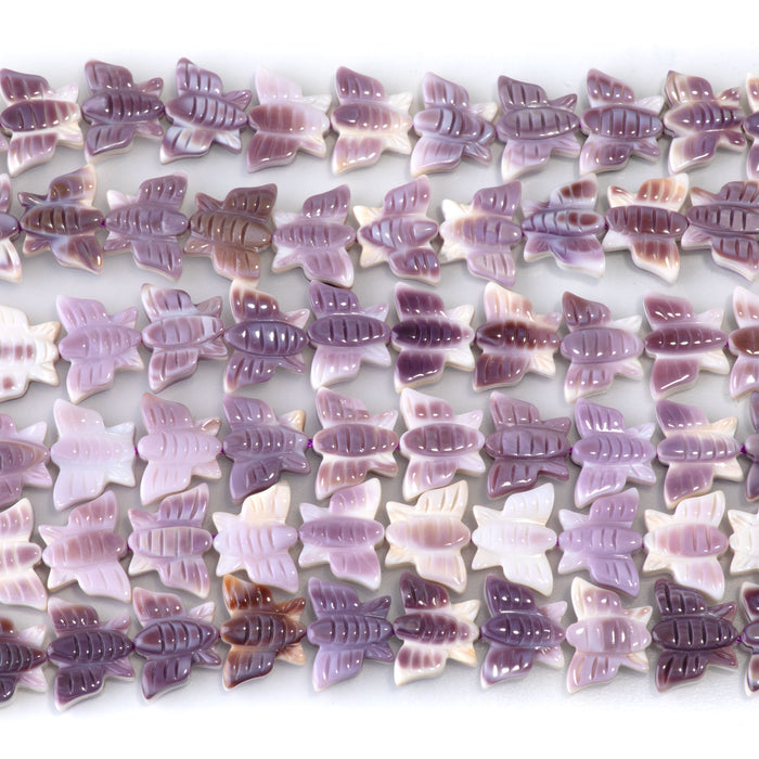 This is a Dakota Stones 8x11mm Wampum Shell Carved Butterfly Gemstone strand of round beads in 15-16 inch strand.