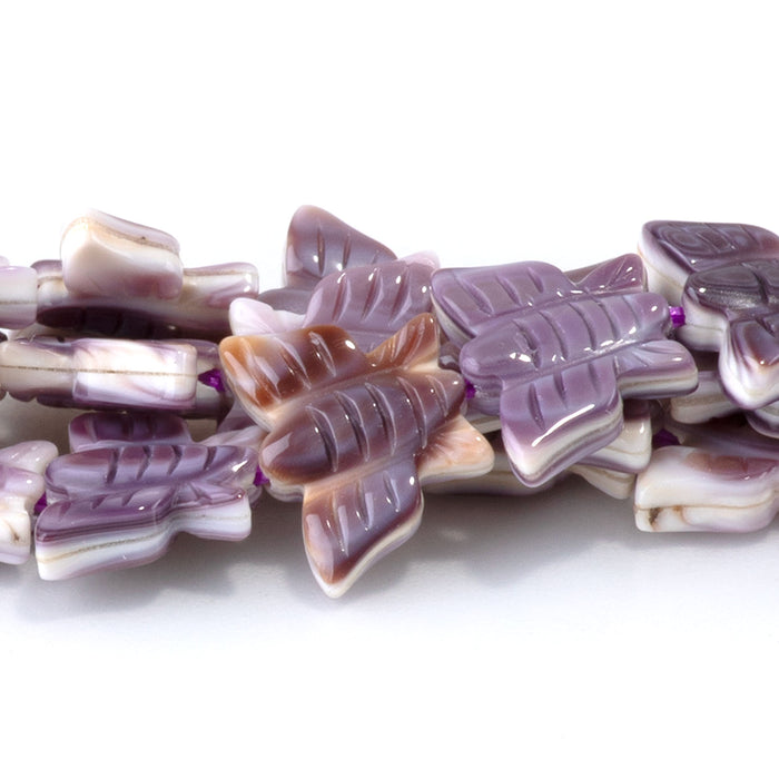 This is a Dakota Stones 8x11mm Wampum Shell Carved Butterfly Gemstone strand of round beads in 15-16 inch strand.