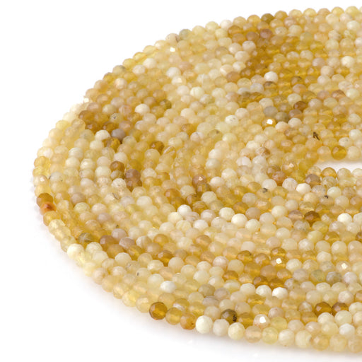 This is a Dakota Stones 4mm Yellow Opal Banded Gemstone strand with AA grade faceted round beads in 15-16 inch strand.