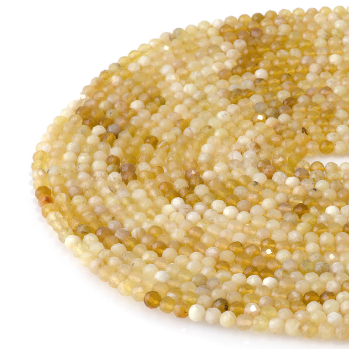 This is a Dakota Stones 4mm Yellow Opal Banded Gemstone strand with AA grade faceted round beads in 15-16 inch strand.