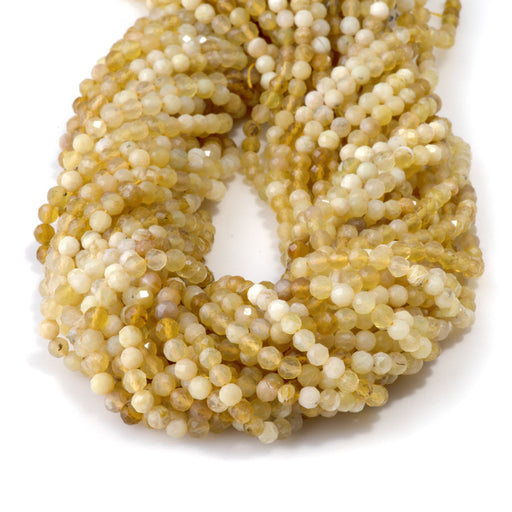 This is a Dakota Stones 4mm Yellow Opal Banded Gemstone strand with AA grade faceted round beads in 15-16 inch strand.