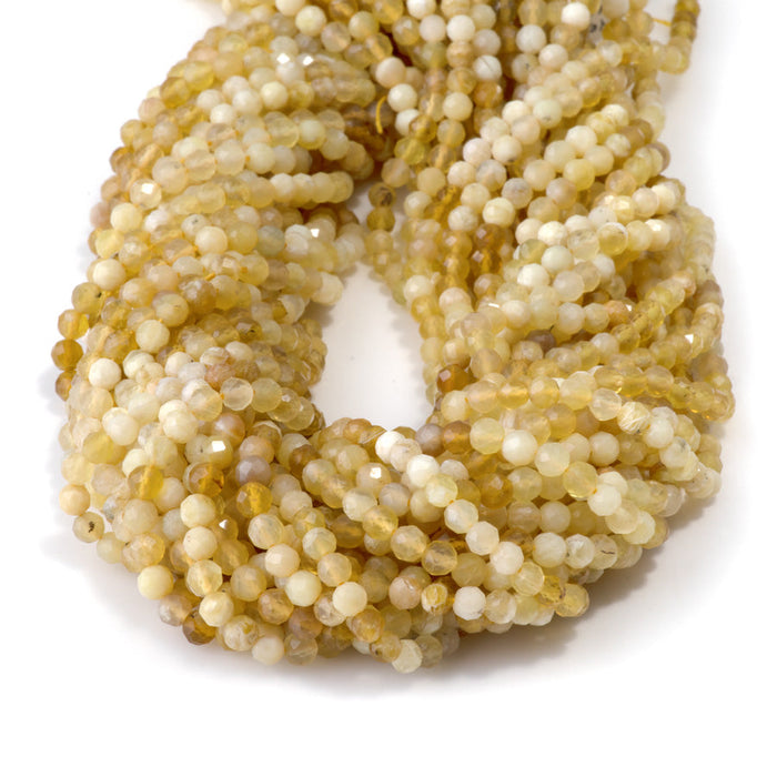 This is a Dakota Stones 4mm Yellow Opal Banded Gemstone strand with AA grade faceted round beads in 15-16 inch strand.