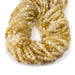 This is a Dakota Stones 4mm Yellow Opal Banded Gemstone strand with AA grade faceted round beads in 15-16 inch strand.