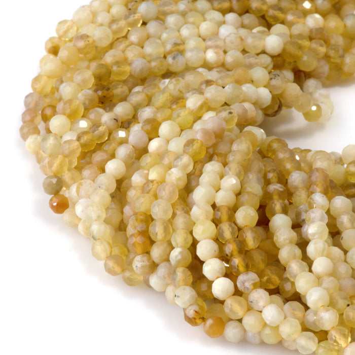 This is a Dakota Stones 4mm Yellow Opal Banded Gemstone strand with AA grade faceted round beads in 15-16 inch strand.