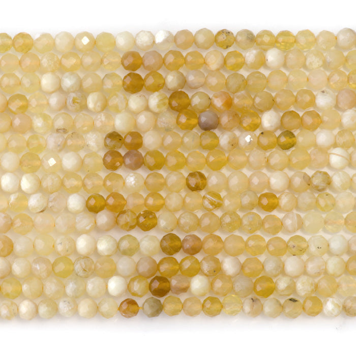 This is a Dakota Stones 4mm Yellow Opal Banded Gemstone strand with AA grade faceted round beads in 15-16 inch strand.