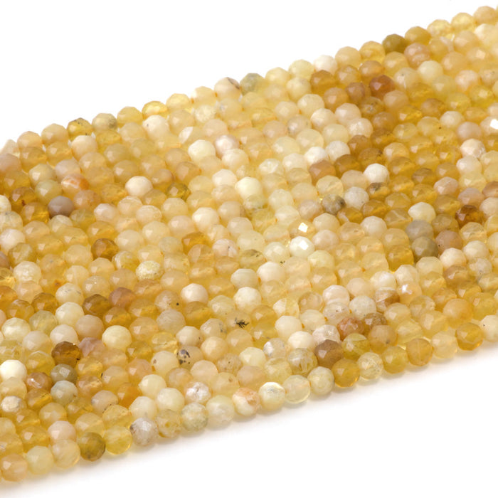 This is a Dakota Stones 4mm Yellow Opal Banded Gemstone strand with AA grade faceted round beads in 15-16 inch strand.
