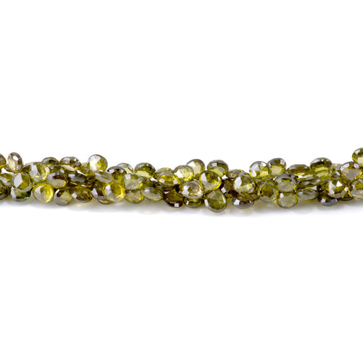 This is a Dakota Stones 6-7mm Zircon Green Top Drill Gemstone strand with faceted drop beads in 8 inch strand.