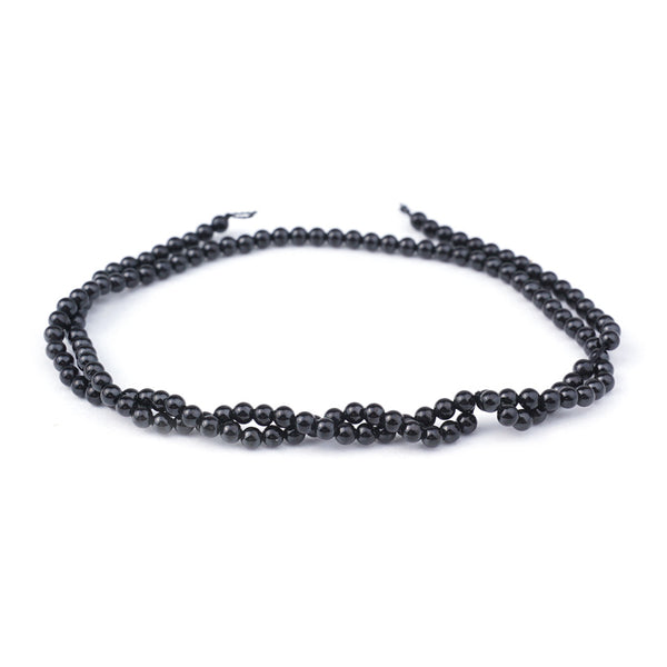 This is a Dakota Stones 3mm Black Spinel Gemstone strand with natural round beads in 15-16 inch strand.
