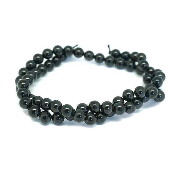 This is a Dakota Stones 6mm Black Spinel Gemstone strand with round beads in 15-16 inch strand.