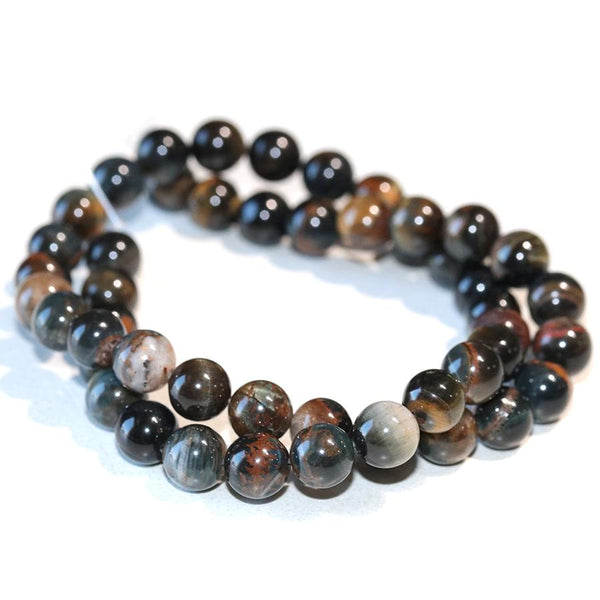 This is a Dakota Stones 8mm Blue Yellow Tiger Eye Gemstone strand with round beads in 15-16 inch strand.