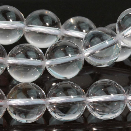 This is a Dakota Stones 10mm Crystal Quartz Gemstone strand with round beads in 15-16 inch strand.