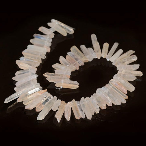 This is a Dakota Stones 4x20-6x40mm Rd Red Crystal Quartz Points Gemstone strand of round beads in 15-16 inch strand.