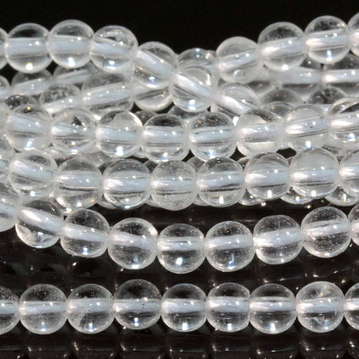 This is a Dakota Stones 4mm Crystal Quartz Gemstone strand with round beads in 15-16 inch strand.
