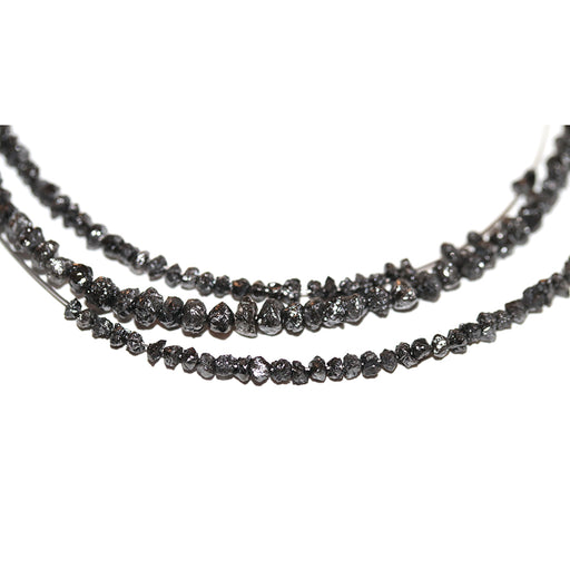 This is a Dakota Stones 2-4mm Diamond Black Gemstone strand with chip beads in 15-16 inch strand.