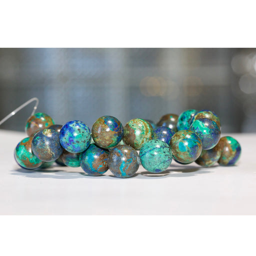 This is a Dakota Stones 16mm Lapis Malachite Gemstone strand with round beads in 15-16 inch strand.