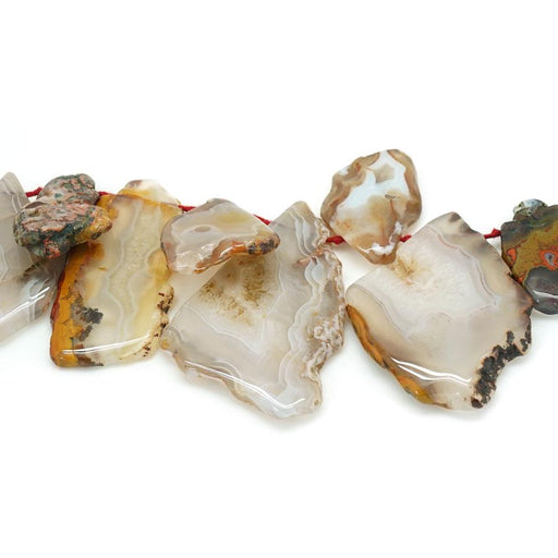 This is a Dakota Stones 10x16-22x50mm Td Morocco Agate Top Drill Gemstone strand of round beads in 15-16 inch strand.