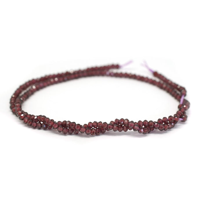 This is a Dakota Stones 2x3mm Purple Garnet Gemstone strand with faceted rondelle beads in 15-16 inch strand.