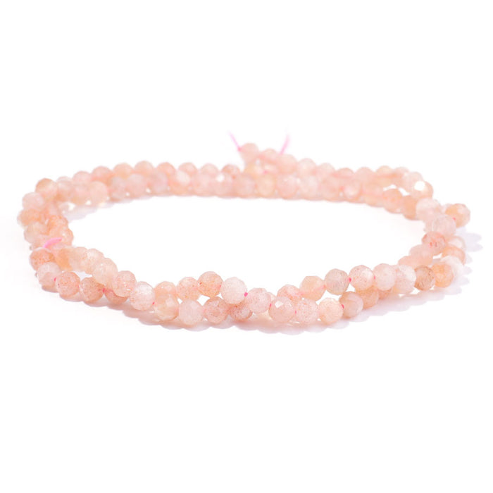 This is a Dakota Stones 4mm Peach Moonstone Gemstone strand with AA grade faceted round beads in 15-16 inch strand.
