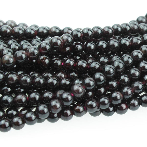 This is a Dakota Stones 3mm Red Garnet Gemstone strand with round beads in 15-16 inch strand.
