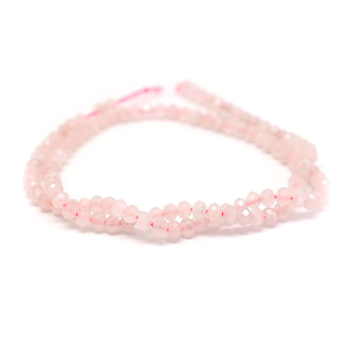 This is a Dakota Stones 3x4mm Rose Quartz Gemstone strand with faceted rondelle beads in 15-16 inch strand.