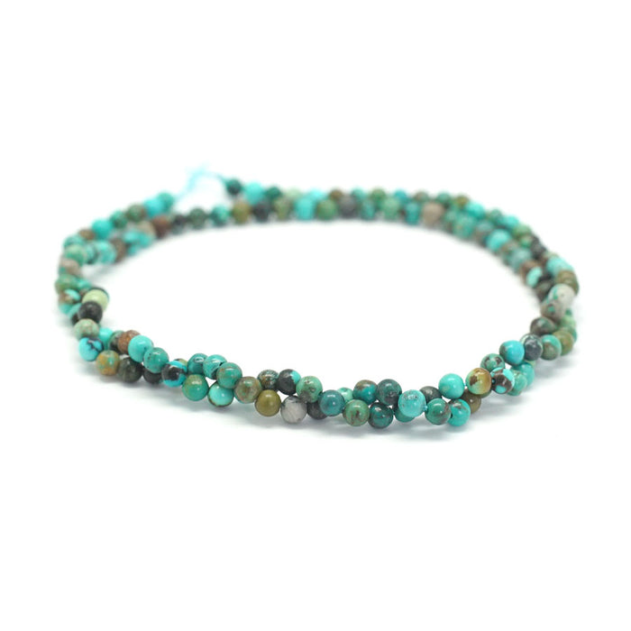This is a Dakota Stones 3mm Grn Hubei Turquoise Green Gemstone strand with round beads in 15-16 inch strand.